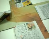A picture of step 5 of Castella Cake in a Newspaper Mold.
