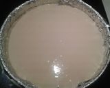 A picture of step 5 of 'Dulce de Leche' ricotta cheesecake with caramelized hazelnuts.