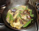 A picture of step 7 of Stir-Fried and Simmered Eggplants, Green Beans and Deep-fried Tofu.