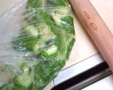 A picture of step 2 of Garlicky Pounded Cucumber Pickles.
