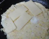 A picture of step 6 of My Folded Omelette with Bacon, Onion and Cheese Inside, Topped with Grated Mozzarella 😘.