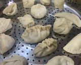 A picture of step 12 of Dumplings served with chilli oil and soya sauce dipping.