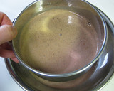 A picture of step 5 of Cocoa Crepe Roll Cake with Whole Strawberries.