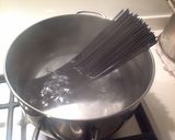 A picture of step 3 of Squid Ink Spaghetti with Shallot Cream and Bottarga.