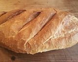 A picture of step 1 of Oval Cheese and Tomato Braai Bread.