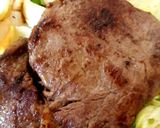 A picture of step 4 of Ribeye Steak onions and mushrooms. With homemade Chips 😀.
