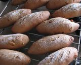 A picture of step 13 of Chewy Little Walnut-Raisin Whole Wheat Rolls.