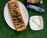 A picture of step 10 of Oreo vanillah cake loaf.