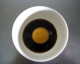 A picture of step 1 of Pork and Asparagus Tossed in Egg Yolk and Soy Sauce.