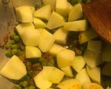A picture of step 2 of Aloo Matar Masala (Potato Peas curry).