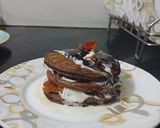 A picture of step 4 of Choco banana pancakes With Orange Marmalade and Fresh cream.
