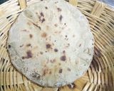 A picture of step 9 of Brinjal Kadhi with bajra roti.