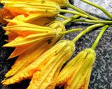 A picture of step 1 of Kakharu Phula Bhaja Pumpkin flower masala fry.