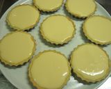 A picture of step 7 of Rich Baked Cheesecake Tarts.