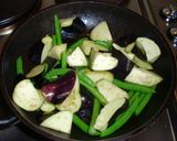 A picture of step 4 of Stir-Fried and Simmered Eggplants, Green Beans and Deep-fried Tofu.