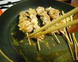 A picture of step 7 of Crispy Salt-Grilled Chicken Skewers in a Skillet.