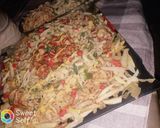 A picture of step 9 of Chicken tikka microni with spicy spaghetti.