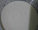 A picture of step 6 of Orange Marble Swiss Roll.