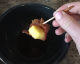 A picture of step 7 of Candied Bacon-Wrapped Pineapple With Honey Sriracha Sauce.