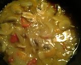 A picture of step 9 of curry mushrooms and peppers in a sauce.