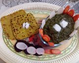 A picture of step 11 of Sarso Ka saag with makki ki roti.