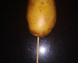 A picture of step 2 of Tornado Potatoes.