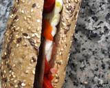 Foto del paso 7 de la receta: Bocadillo con tomate, queso fresco, pimientos del piquillo y anchoas