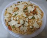A picture of step 7 of Chicken noodles with white sauce.