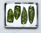 A picture of step 1 of Cheesy Rice Stuffed Poblanos.
