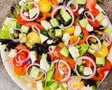 A picture of step 3 of Greek salad with shrimps.
