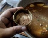 A picture of step 12 of Aloo Qeema.