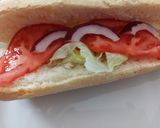 A picture of step 2 of BBQ chicken panino with buttered Corn on the cob.
