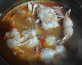 A picture of step 5 of Colourful Stringhoppers with Crab stew.