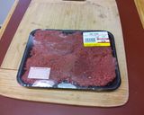 A picture of step 1 of Lee's Smothered Swiss Style Steaks.