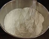 A picture of step 10 of Vanilla Layer Cake with Whipped White Chocolate Filling and Fros.