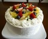 A picture of step 9 of Summer Fruit Decorated Cake.