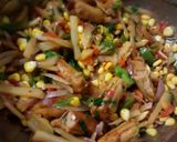A picture of step 4 of Zingy pepper chicken sausages & sweet corn.