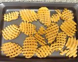 A picture of step 2 of Layered Bacon Chili Cheddar Cheese Waffle Fries.