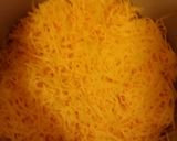A picture of step 7 of Taisen's chili cheese hot dog w/tots.