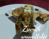 A picture of step 4 of Arabic Mutabbaq with Spring Rolls.