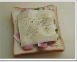 A picture of step 4 of Spinach and Bacon Cheese Toast.