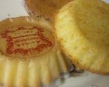 A picture of step 12 of Fluffy Madeleines with Orange Peels.