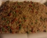 A picture of step 4 of Spicy garlic rice with peas and carrots.
