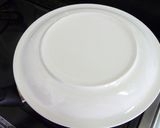 A picture of step 12 of Pancake Mix Cinnamon Apple Cake in a Frying Pan.