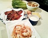 A picture of step 6 of Ceaser salad with prawns.