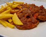 Foto del paso 7 de la receta: Filetes de cerdo en salsa de tomate y pimientos con patatas