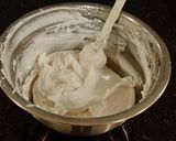 A picture of step 23 of White Layer Cake with a Raspberry Swirl Cheesecake center layer and a Raspberry Cream Frosting.