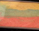A picture of step 11 of Rainbow Sherbet ( Sorbet ) Filled Striped Vanilla Cake Roll.