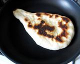A picture of step 8 of Light and Puffy Homemade Naan Bread in a Pan.