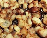 A picture of step 5 of Sherry chicken with pearl onions.